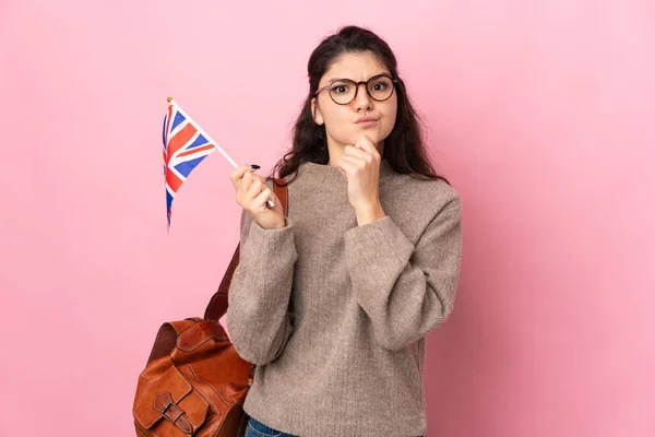 Young Russian Woman Holding United Kingdom Flag Isolated Pink Background — Stok fotoğraf