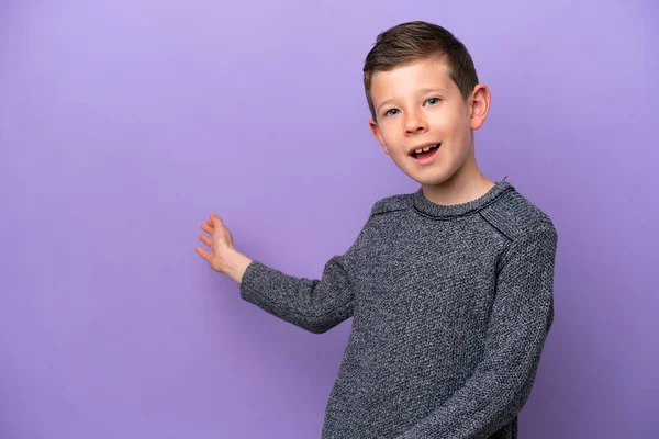 Little Boy Isolated Purple Background Extending Hands Side Inviting Come — ストック写真