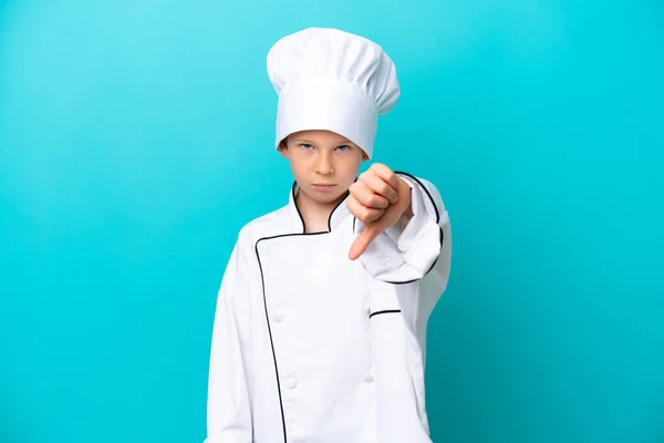 Piccolo Chef Ragazzo Isolato Sfondo Blu Mostrando Pollice Verso Basso — Foto Stock
