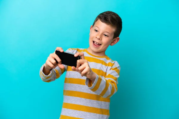 Little Boy Isolated Blue Background Playing Mobile Phone — Stock Photo, Image