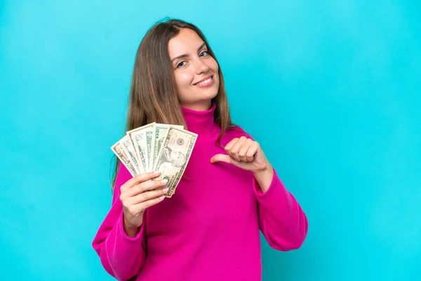 Young Caucasian Woman Taking Lot Money Isolated Blue Background Proud — Stock Photo, Image