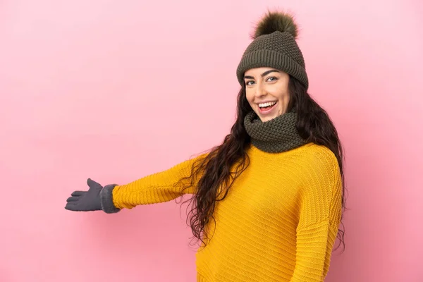 Young Caucasian Girl Winter Hat Isolated Purple Background Extending Hands — Fotografia de Stock