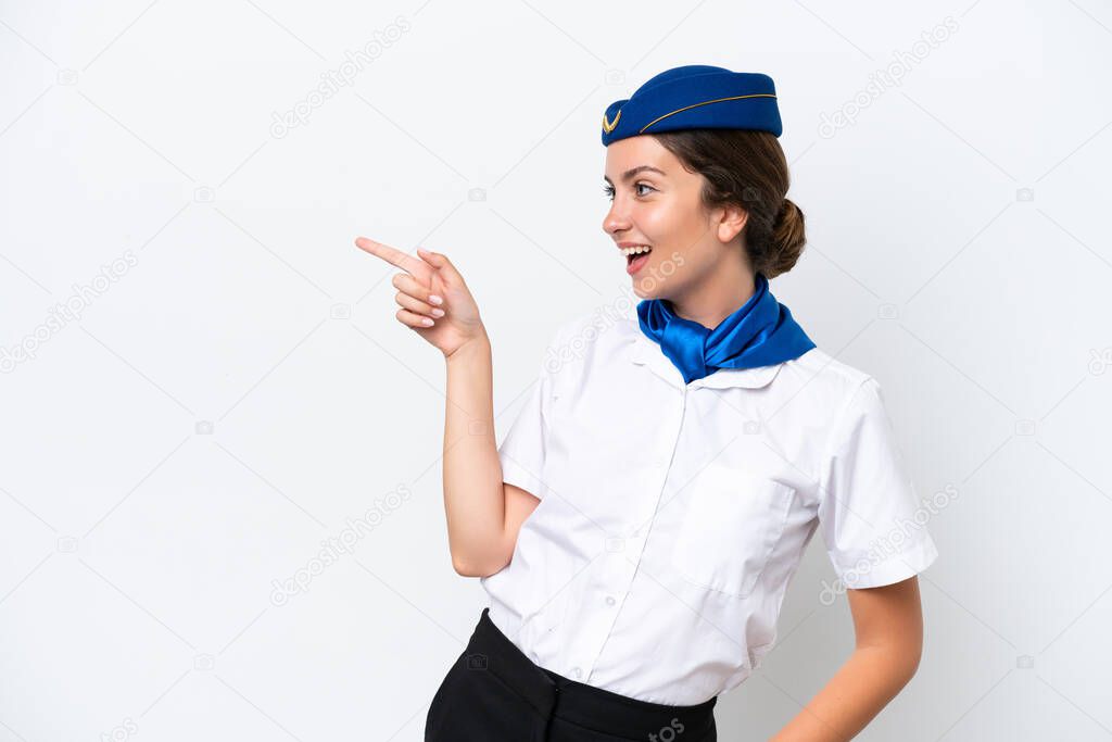 Airplane stewardess caucasian woman isolated on white background pointing finger to the side and presenting a product