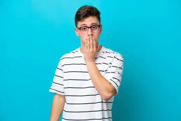 Young Handsome Brazilian Man Isolated Blue Background Covering Mouth Hand — Foto de Stock