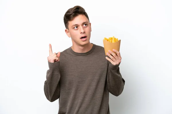 Young Brazilian Man Holding Fried Chips Isolated White Background Thinking — 图库照片