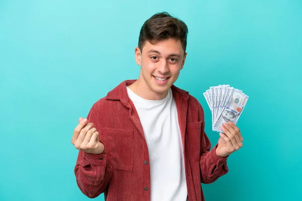 Young Brazilian Man Taking Lot Money Isolated Blue Background Making — стоковое фото