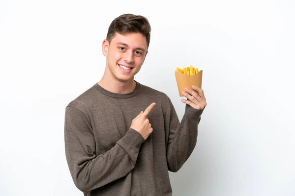 Young Brazilian Man Holding Fried Chips Isolated White Background Pointing — 图库照片
