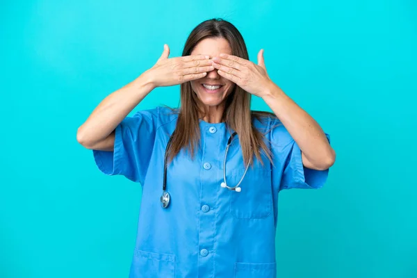 Middle Age Surgeon Woman Isolated Blue Background Covering Eyes Hands — Stockfoto