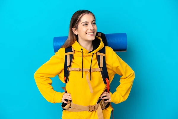 Young Mountaineer Woman Big Backpack Isolated Blue Background Posing Arms —  Fotos de Stock