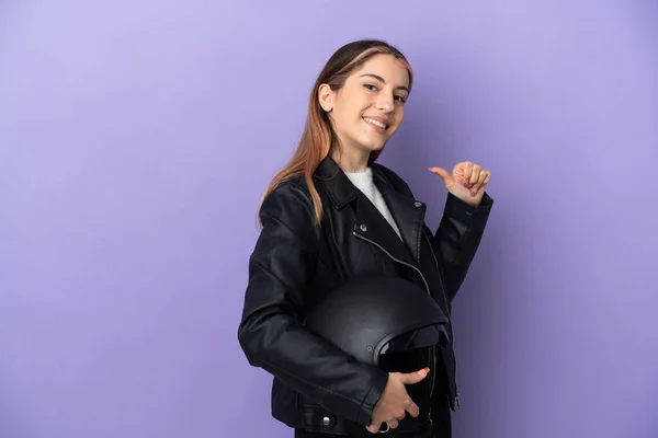 Young Caucasian Woman Holding Motorcycle Helmet Isolated Purple Background Proud —  Fotos de Stock