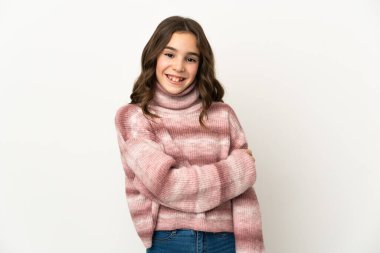 Beyaz arka planda izole edilmiş küçük beyaz kız gülüyor.