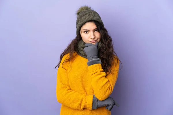 Teenager Russian Girl Winter Hat Isolated Purple Background Thinking — Stockfoto