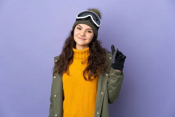 Teenager Russian Girl Snowboarding Glasses Isolated Purple Background Showing Lifting — Stockfoto