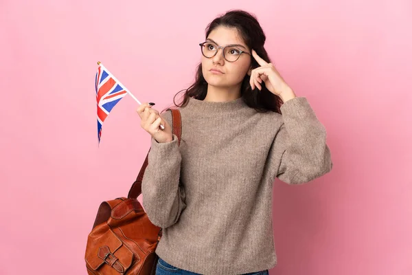 Young Russian Woman Holding United Kingdom Flag Isolated Pink Background — Stok fotoğraf