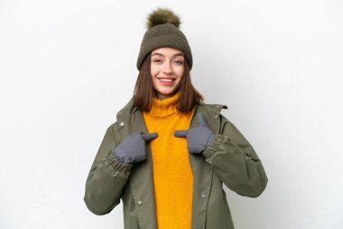 Young Ukrainian woman wearing winter jacket isolated on white background with surprise facial expression