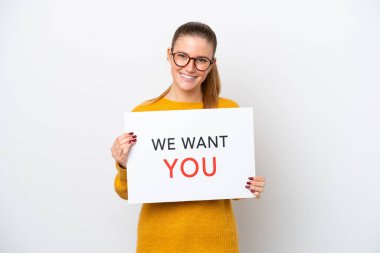 Young caucasian woman isolated on white background holding We Want You board with happy expression