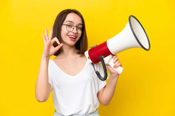 Young Ukrainian Woman Isolated Yellow Background Holding Megaphone Showing Sign —  Fotos de Stock