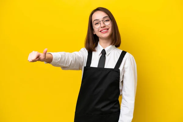 Young Ukrainian Waitress Woman Isolated Yellow Background Giving Thumbs Gesture — Stock fotografie