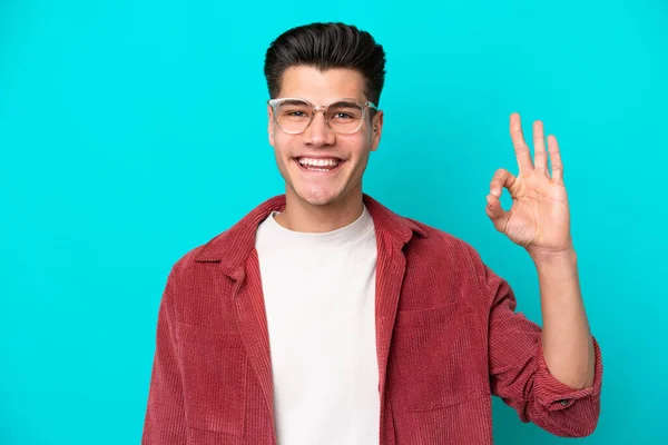 Young Handsome Caucasian Man Isolated Blue Bakcground Glasses Doing Sign — Stockfoto