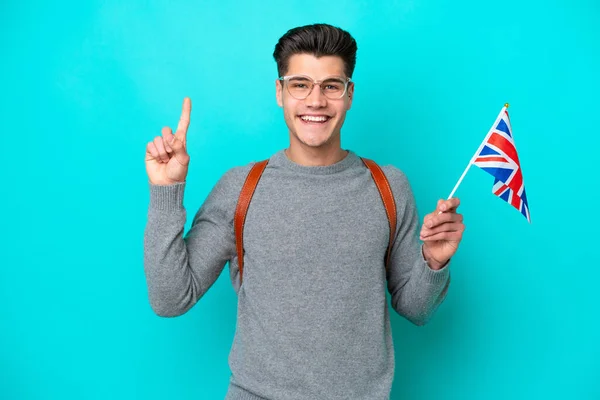 Young Caucasian Man Holding United Kingdom Flag Isolated Blue Background — Stock fotografie