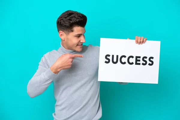 Young Handsome Caucasian Man Isolated Blue Bakcground Holding Placard Text — Stock Photo, Image