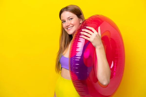 Young Caucasian Woman Holding Air Mattress Isolated Yellow Background Smiling — ストック写真