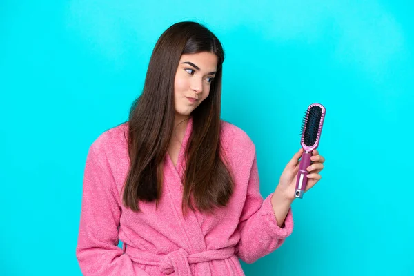 Young Brazilian Woman Holding Hairbrush Isolated Blue Background Sad Expression —  Fotos de Stock