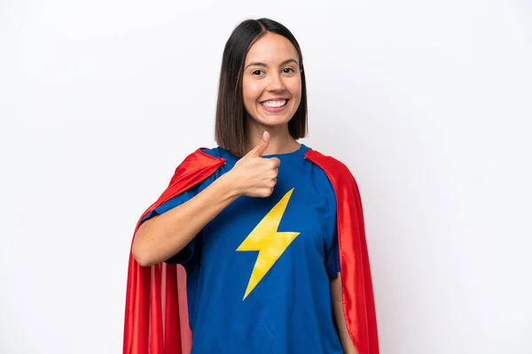 Super Hero caucasian woman isolated on white background giving a thumbs up gesture