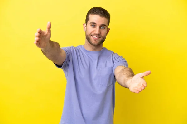 Handsome Blonde Man Isolated Yellow Background Presenting Inviting Come Hand — Stok fotoğraf