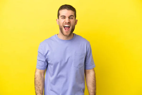 Handsome Blonde Man Isolated Yellow Background Shouting Front Mouth Wide — Zdjęcie stockowe