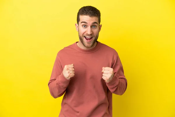 Handsome Blonde Man Isolated Yellow Background Celebrating Victory Winner Position — Stock fotografie