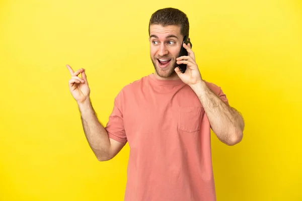 Handsome Blonde Man Using Mobile Phone Isolated Background Intending Realizes — Stock Photo, Image