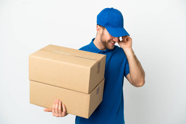 Delivery man over isolated white background laughing