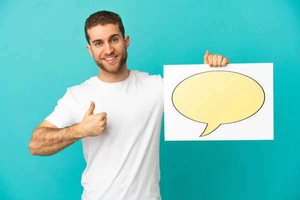 Handsome Blonde Man Isolated Blue Background Holding Placard Speech Bubble — ストック写真