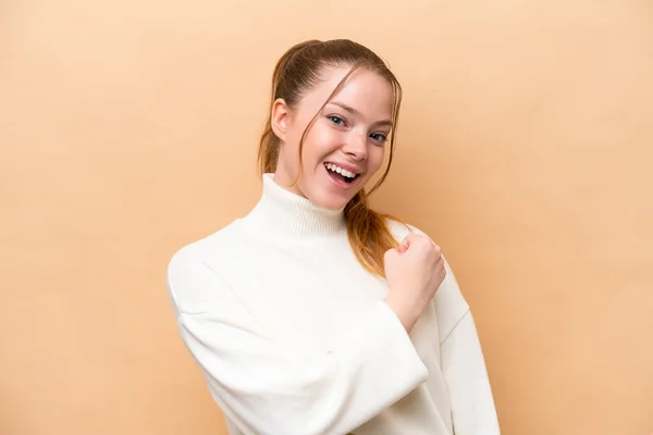 Young Caucasian Woman Isolated Beige Background Celebrating Victory — Stock Photo, Image