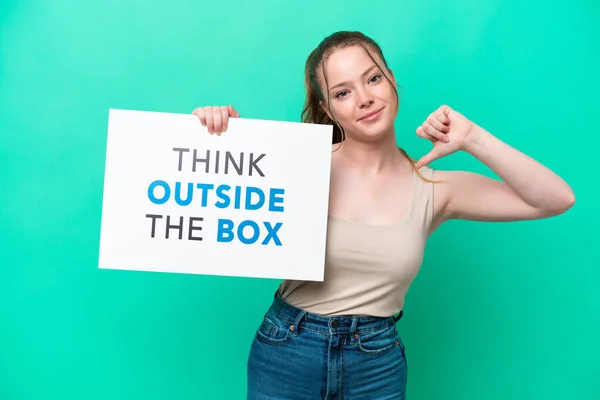 Young Caucasian Woman Isolated Green Background Holding Placard Text Think — Zdjęcie stockowe