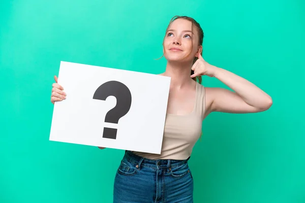 Young Caucasian Woman Isolated Green Background Holding Placard Question Mark — Stock fotografie