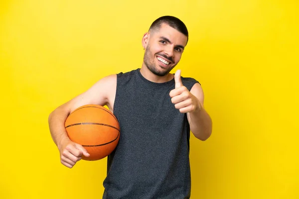 Young Caucasian Basketball Player Man Isolated Yellow Background Thumbs Because — 스톡 사진