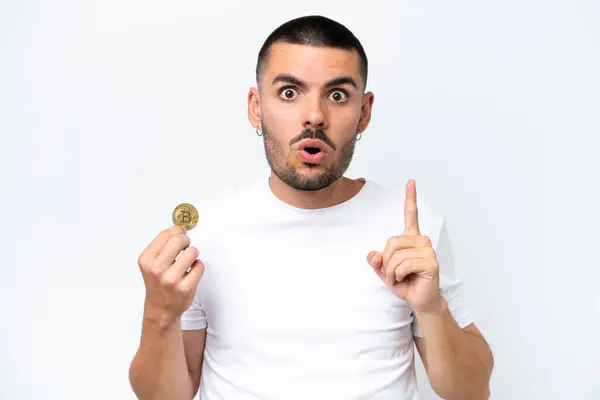 Young Caucasian Man Holding Bitcoin Isolated White Background Intending Realizes — Stockfoto