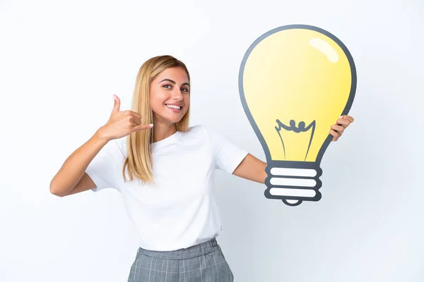 Blonde Uruguayan Girl Isolated White Background Holding Bulb Icon Doing — Stock Photo, Image