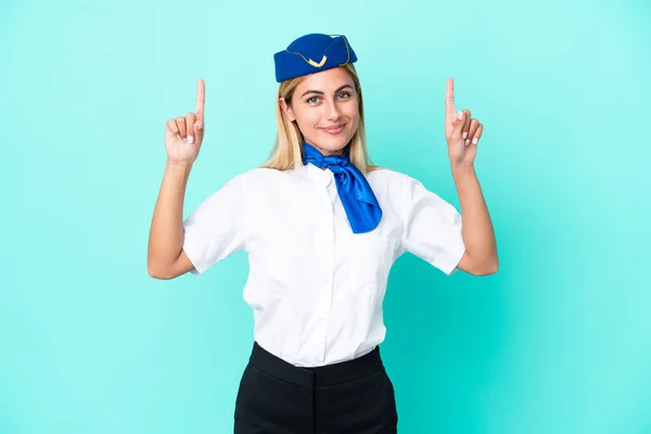 Hôtesse Air Uruguayenne Femme Isolée Sur Fond Bleu Pointant Vers — Photo