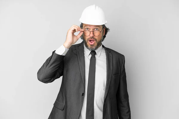 Young Architect Man Helmet Isolated Background Glasses Surprised — Stock Photo, Image