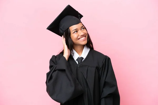 Young university Colombian woman graduate isolated on pink background thinking an idea