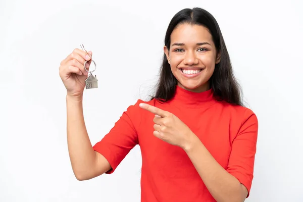 Young Colombian Woman Holding Home Keys Isolated White Background Pointing — 图库照片