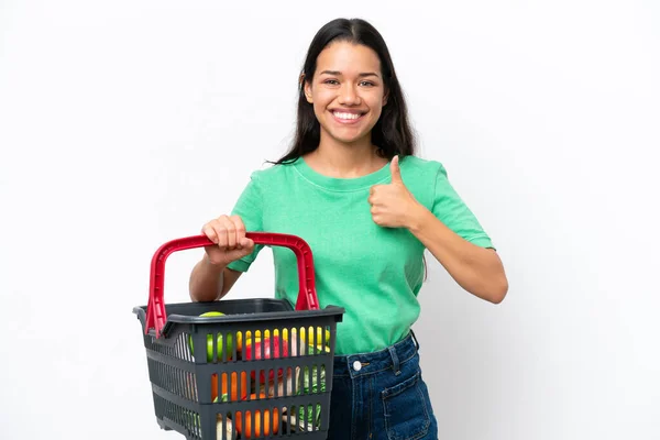 Young Colombian Woman Holding Shopping Basket Full Food Isolated White — Stock fotografie