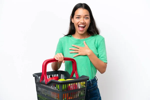 Young Colombian Woman Holding Shopping Basket Full Food Isolated White — Φωτογραφία Αρχείου