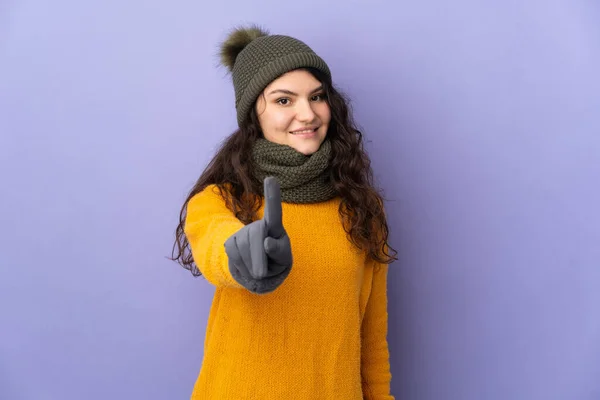 Teenager Russian Girl Winter Hat Isolated Purple Background Showing Lifting — Stockfoto