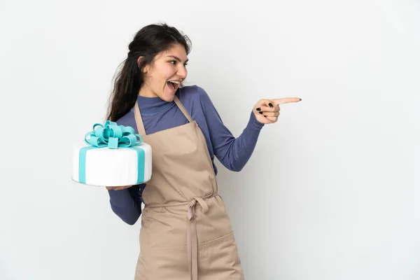 Pastry Russian Chef Holding Big Cake Isolated White Background Pointing — Photo