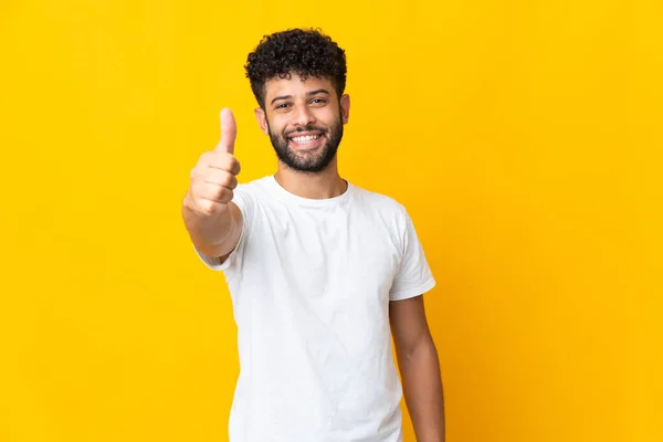 Young Moroccan Man Isolated Yellow Background Thumbs Because Something Good — Stockfoto