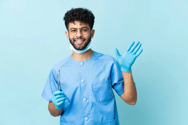 Moroccan Dentist Man Holding Tools Isolated Blue Background Saluting Hand — Fotografia de Stock